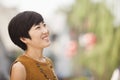 Portrait of Smiling Young Woman in Nanluoguxiang, Beijing, China