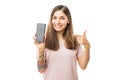 Portrait Of Smiling Young Woman Pointing At New Smartphone