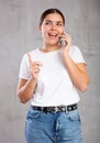 Cheerful young woman talking on mobile phone Royalty Free Stock Photo