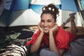 Portrait of smiling young woman in tent Royalty Free Stock Photo