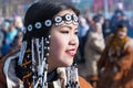 Portrait smiling young woman in traditional clothing indigenous inhabitants of Kamchatka Peninsula. Celebration Koryak