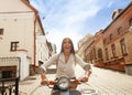 Portrait smilling beautiful girl sitting on retro scooter. Royalty Free Stock Photo