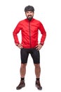 Portrait of smilling bicyclist with helmet and red jacket, isolated on white. Royalty Free Stock Photo