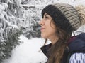 Portrait of snowboarder girl on the background of snow forest Royalty Free Stock Photo