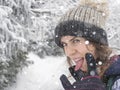 Portrait of snowboarder girl on the background of snow forest Royalty Free Stock Photo