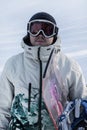 Portrait of a snowboarder in goggles at a ski resort, close-up. Royalty Free Stock Photo