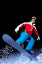 Portrait of snowboarder jumping at night Royalty Free Stock Photo