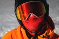 Portrait of a snowboarder. Ski goggles and ski helmet on a man looking at the camera, close-up. Holidays in the ski Royalty Free Stock Photo