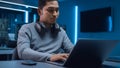 Portrait of Software Developer / Hacker / Programmer Sitting at His Desk and Working on Laptop Com Royalty Free Stock Photo