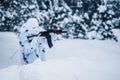 Portrait of soldier in camouflage and white mask balaclava with