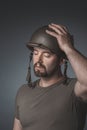 Portrait of a soldier with his hand on his helmet and his eyes closed Royalty Free Stock Photo