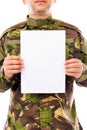 Portrait of a soldier holding white sheet of paper Royalty Free Stock Photo