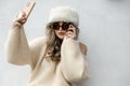 Portrait of beautiful woman taking a selfie with hair cap and large glasses Royalty Free Stock Photo