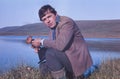 Portrait of soviet gold-prospector mushrooming in tundra