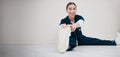 Portrait, space and a nurse stretching on the floor of a studio, getting ready for healthcare or medical treatment