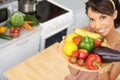 Portrait, space and vegetables with a woman in the kitchen of her home for nutrition, diet or meal preparation. Face
