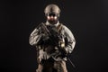 Portrait of special forces in a military uniform with weapons at night, elite troops, counter terrorist against a dark background Royalty Free Stock Photo