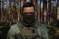 Portrait of a special operations forces man wearing a balaclava on his face in the forest Royalty Free Stock Photo