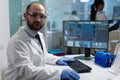 Portrait of specialist biochemist researcher working at clinical experiment