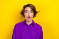 Portrait of speechless business lady open mouth listen wow news wear elegant violet shirt isolated yellow bright color