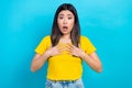 Portrait of speechless woman with dyed hairstyle wear stylish t-shirt arms on chest open mouth staring isolated on blue