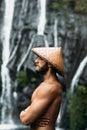 Portrait of a sports guy in an Asian conical hat. Portrait of a man in profile. Portrait of a bearded man.