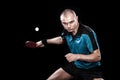 Portrait of sports man, male, athlete playing table tennis isolated on black background Royalty Free Stock Photo