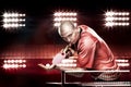 Portrait of sports man, male, athlete playing table tennis isolated on black background Royalty Free Stock Photo