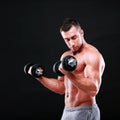 Portrait of a sportsman lifting dumbbells