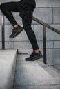 Portrait of sportsman running up stairs