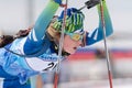 Portrait sportswoman biathlete Anastasia Legostaeva Nyagan at finish after rifle shooting, skiing. Open regional youth