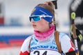 Portrait sportswoman biathlete Vlada Shishkina (St. Petersburg) at finish after skiing, rifle shooting. Junior