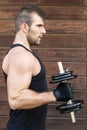 Portrait of sporty man exercising dumbbells. Royalty Free Stock Photo