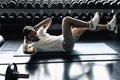 Portrait of sporty man exercising in fitness gym., Athletic young man doing sit-ups or cycling workout posing in front of Royalty Free Stock Photo