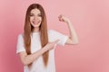 Portrait of sporty woman direct finger show biceps toothy smile