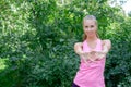 Portrait of sporty woman doing stretching exercises in park before training. Female athlete preparing for jogging Royalty Free Stock Photo