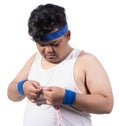 Portrait of sporty young man measure his chest size Royalty Free Stock Photo