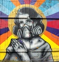 Portrait of a spray paint street artist with respirator.