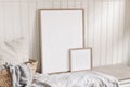 Portrait and square empty wooden frame mockups with straw basket and linen cloth. White beadboard wainscot wall paneling