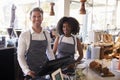 Portrait Of Staff Working At Delicatessen Checkout Royalty Free Stock Photo