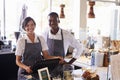 Portrait Of Staff Working At Delicatessen Checkout Royalty Free Stock Photo