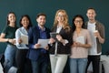 Portrait of standing in row smiling team looking at camera. Royalty Free Stock Photo