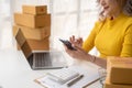 Portrait of Starting small businesses SME owners female entrepreneurs working on receipt box and check online orders to prepare to