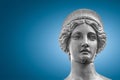 Portrait of a statue of young beautiful sensual Renaissance Era women in Vienna at smooth gradient blue background, Austria Royalty Free Stock Photo