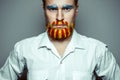 Portrait Of A Stern Man With beard, Unraveled In Colors Of The Flag Of Catalonia. Referendum In Catalonia Royalty Free Stock Photo