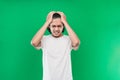 Portrait of stressed Asian man long black hair while holding the head Royalty Free Stock Photo