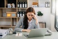 portrait of stressed business woman with social network diagram in the office