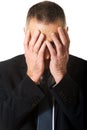 Portrait of stressed businessman covering his face Royalty Free Stock Photo