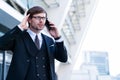 Businessman speaks by phone with his head in hands in frustration. Royalty Free Stock Photo