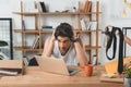 portrait of stressed businessman in underwear sitting at workplace with laptop and cup Royalty Free Stock Photo